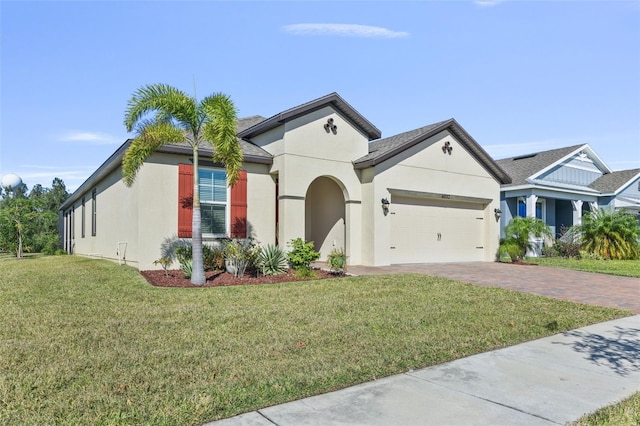 view of front facade with a garage and a front lawn