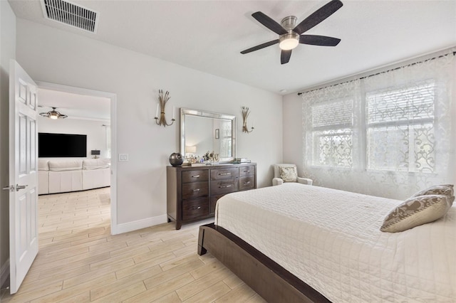 bedroom featuring multiple windows and ceiling fan