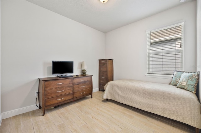 bedroom with light hardwood / wood-style floors