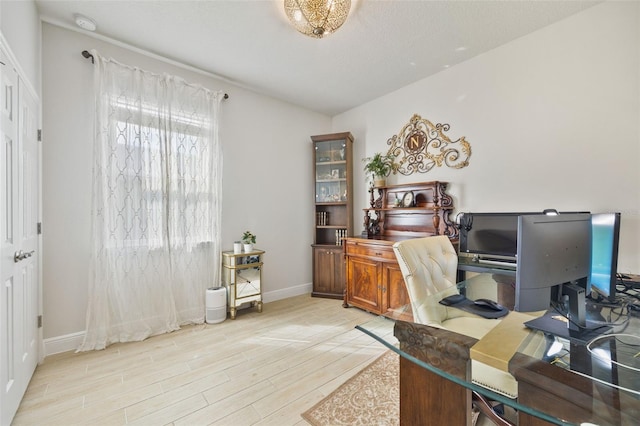 office with light hardwood / wood-style flooring