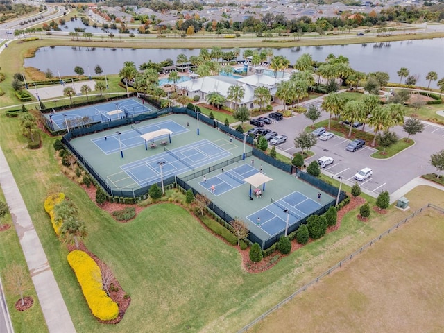 birds eye view of property with a water view