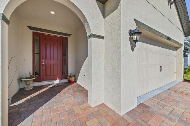 doorway to property featuring a garage