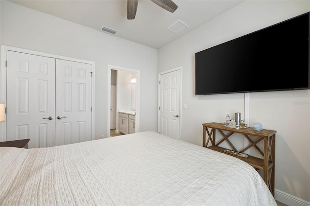 bedroom featuring ensuite bath, ceiling fan, and a closet