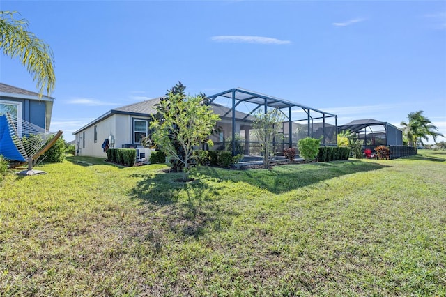 view of yard featuring glass enclosure