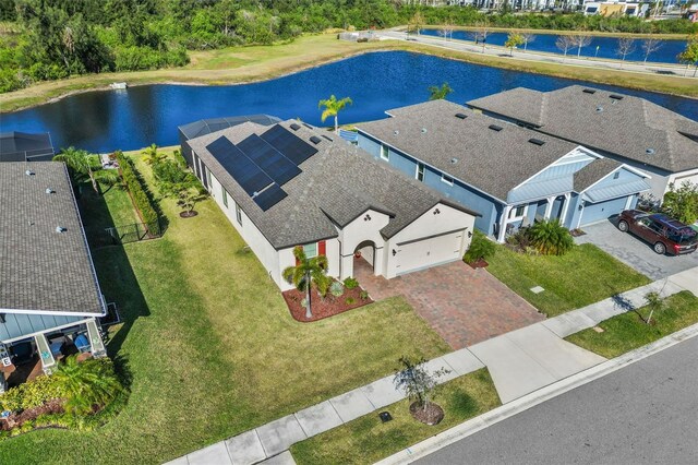 birds eye view of property featuring a water view