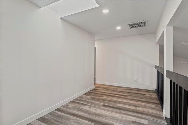 basement featuring wood-type flooring