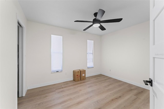 spare room with ceiling fan and light hardwood / wood-style floors