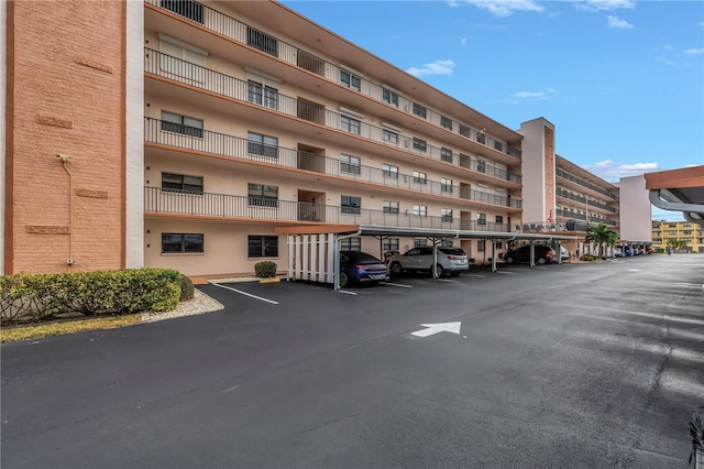 8174 Terrace Garden Dr N Unit 110, Saint Petersburg, FL 33709 - view of apartment building / complex with covered parking