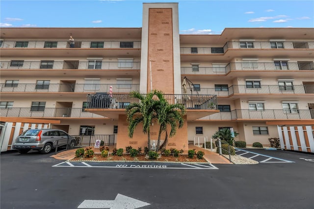 8174 Terrace Garden Dr N Unit 110, Saint Petersburg, FL 33709 - view of apartment building / complex featuring uncovered parking