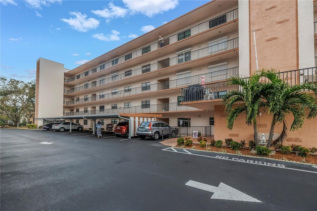 8174 Terrace Garden Dr N Unit 110, Saint Petersburg, FL 33709 - view of apartment building / complex with covered parking