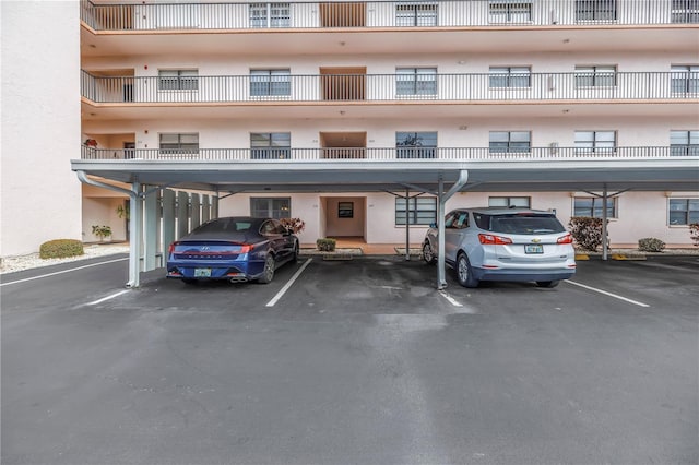 8174 Terrace Garden Dr N Unit 110, Saint Petersburg, FL 33709 - view of apartment building / complex featuring covered parking