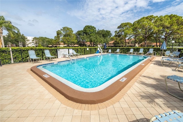 8174 Terrace Garden Dr N Unit 110, Saint Petersburg, FL 33709 - community pool featuring a patio