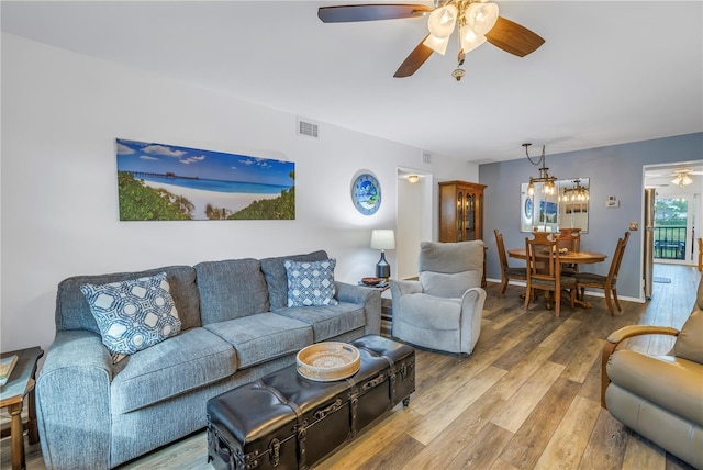 8174 Terrace Garden Dr N Unit 110, Saint Petersburg, FL 33709 - living room with a ceiling fan and wood finished floors