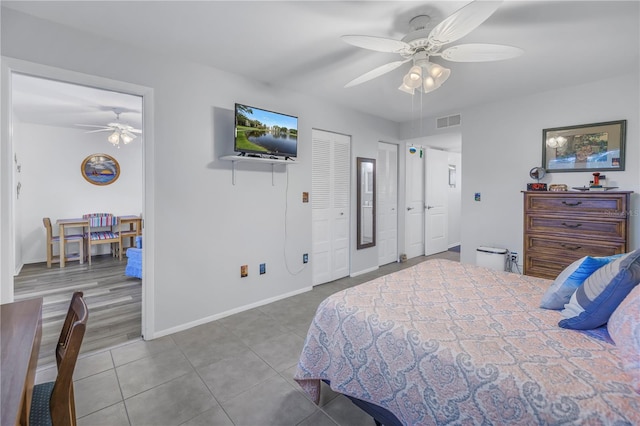8174 Terrace Garden Dr N Unit 110, Saint Petersburg, FL 33709 - tiled bedroom with baseboards and a ceiling fan