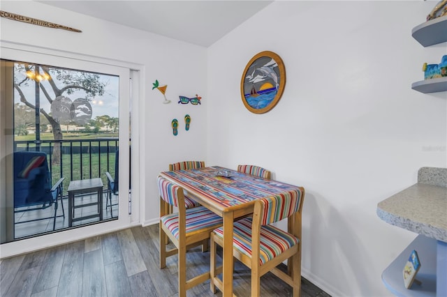 8174 Terrace Garden Dr N Unit 110, Saint Petersburg, FL 33709 - dining area featuring wood finished floors and baseboards