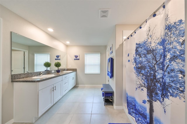 bathroom featuring tile patterned flooring, vanity, and a shower with curtain