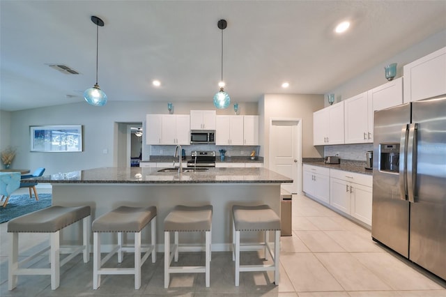 kitchen with white cabinetry, sink, and appliances with stainless steel finishes