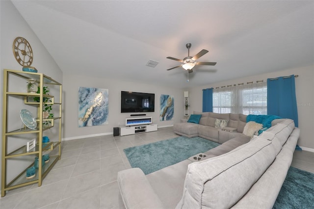 tiled living room featuring ceiling fan