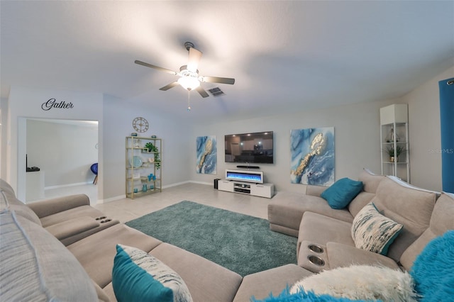 living room with ceiling fan and light tile patterned floors