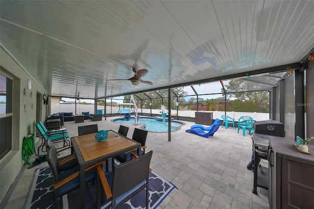 exterior space featuring outdoor lounge area, ceiling fan, and a fenced in pool