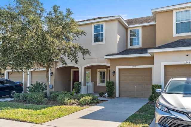 townhome / multi-family property featuring a garage