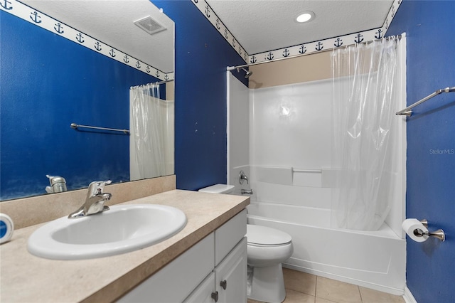 full bathroom with tile patterned floors, vanity, a textured ceiling, shower / bath combo with shower curtain, and toilet