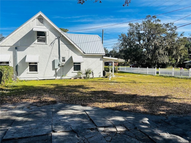 rear view of house with a lawn