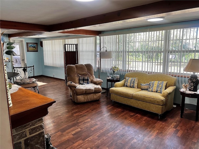 living room featuring beam ceiling and dark hardwood / wood-style flooring