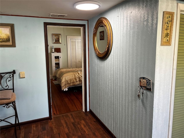 hallway with dark wood-type flooring