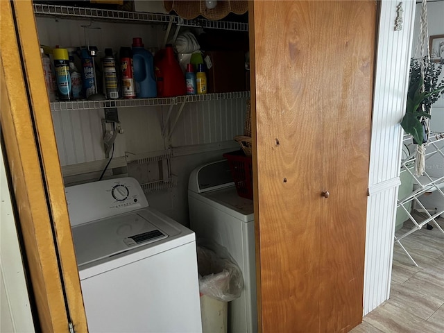 clothes washing area featuring washer and dryer