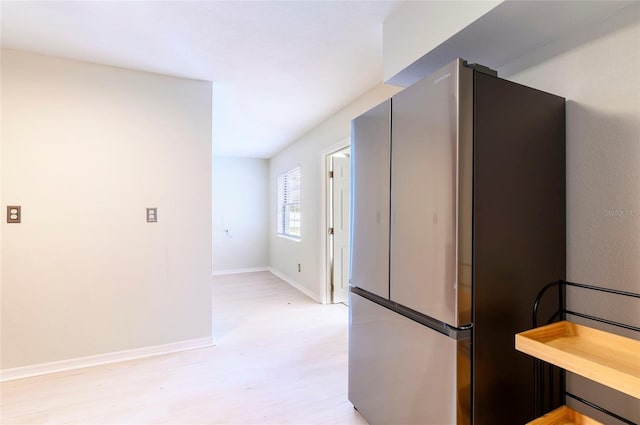 kitchen featuring stainless steel refrigerator and light wood-type flooring