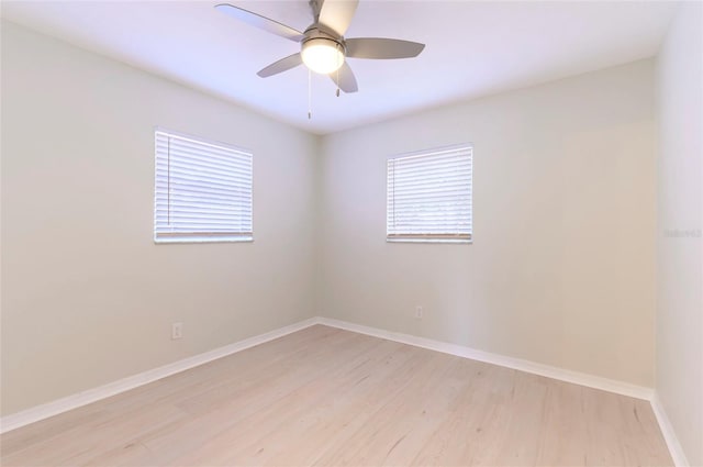 spare room featuring ceiling fan and light hardwood / wood-style flooring