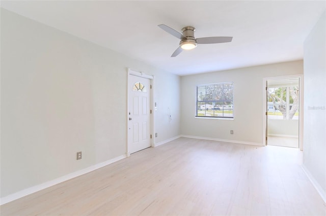 spare room with ceiling fan and light hardwood / wood-style flooring