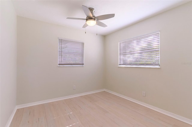 unfurnished room with ceiling fan and light wood-type flooring