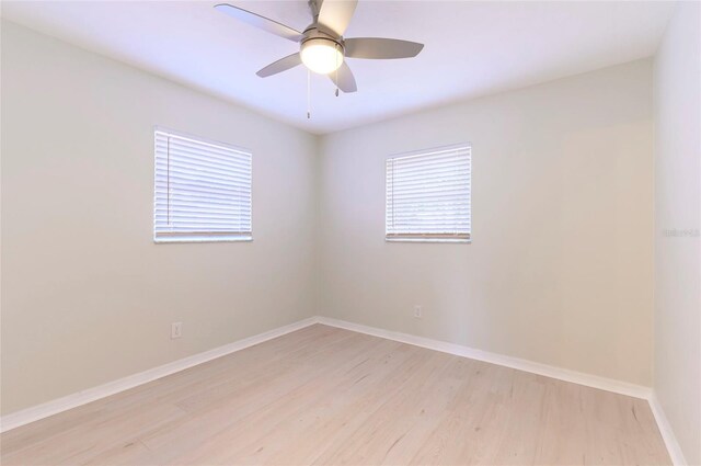 spare room featuring ceiling fan and light wood-type flooring