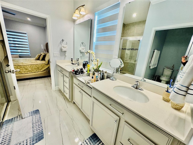 bathroom with walk in shower, vanity, and toilet