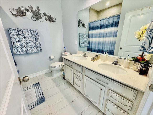 bathroom with vanity, toilet, and walk in shower