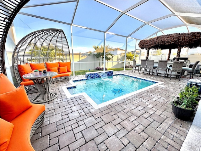 view of pool featuring pool water feature, glass enclosure, an outdoor hangout area, and a patio