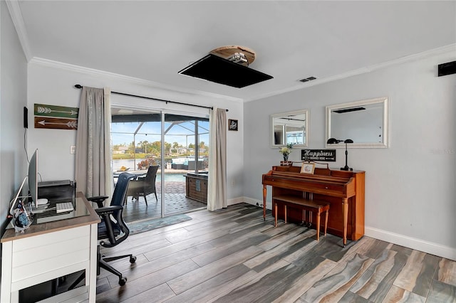 home office with crown molding and hardwood / wood-style floors