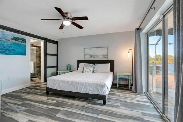 bedroom featuring access to outside, ensuite bath, ceiling fan, and hardwood / wood-style flooring