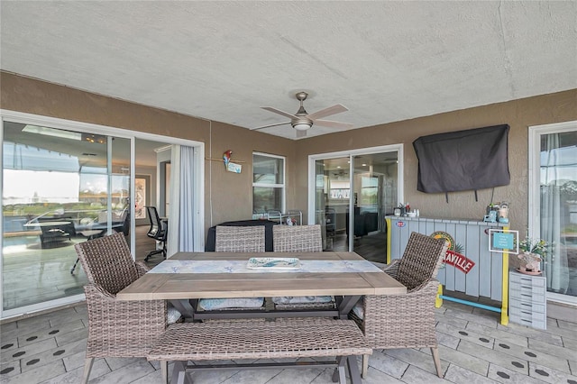 view of patio / terrace featuring ceiling fan