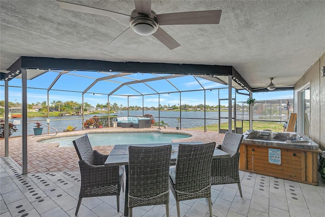 view of patio / terrace with an outdoor hangout area, a water view, and a lanai