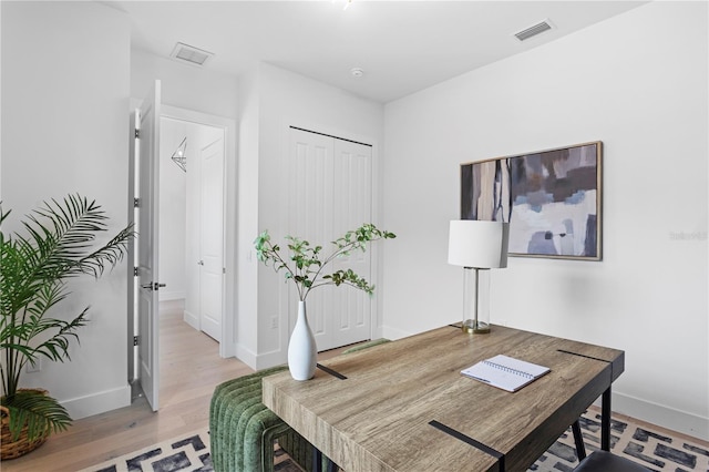 office with light hardwood / wood-style floors