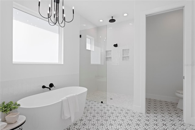 bathroom with toilet, tile patterned flooring, independent shower and bath, and a notable chandelier