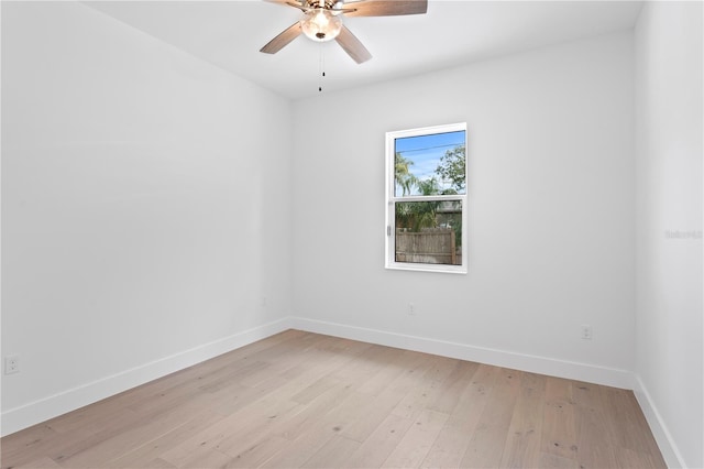 spare room featuring ceiling fan and light hardwood / wood-style floors