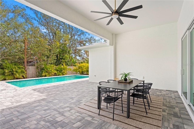 view of pool with ceiling fan and a patio