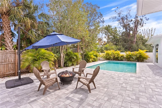 view of pool featuring a patio area and an outdoor fire pit