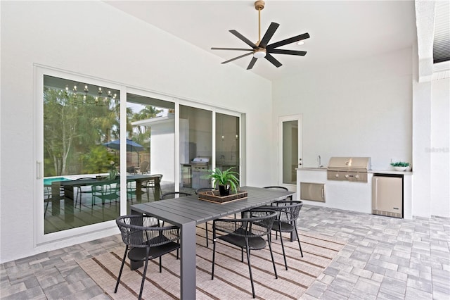 view of patio / terrace featuring area for grilling, ceiling fan, and sink