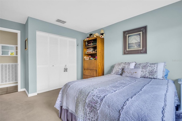 carpeted bedroom featuring a closet