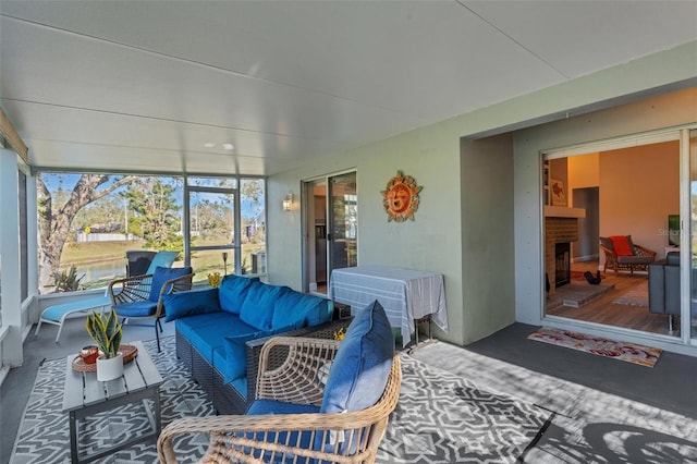 sunroom with a fireplace